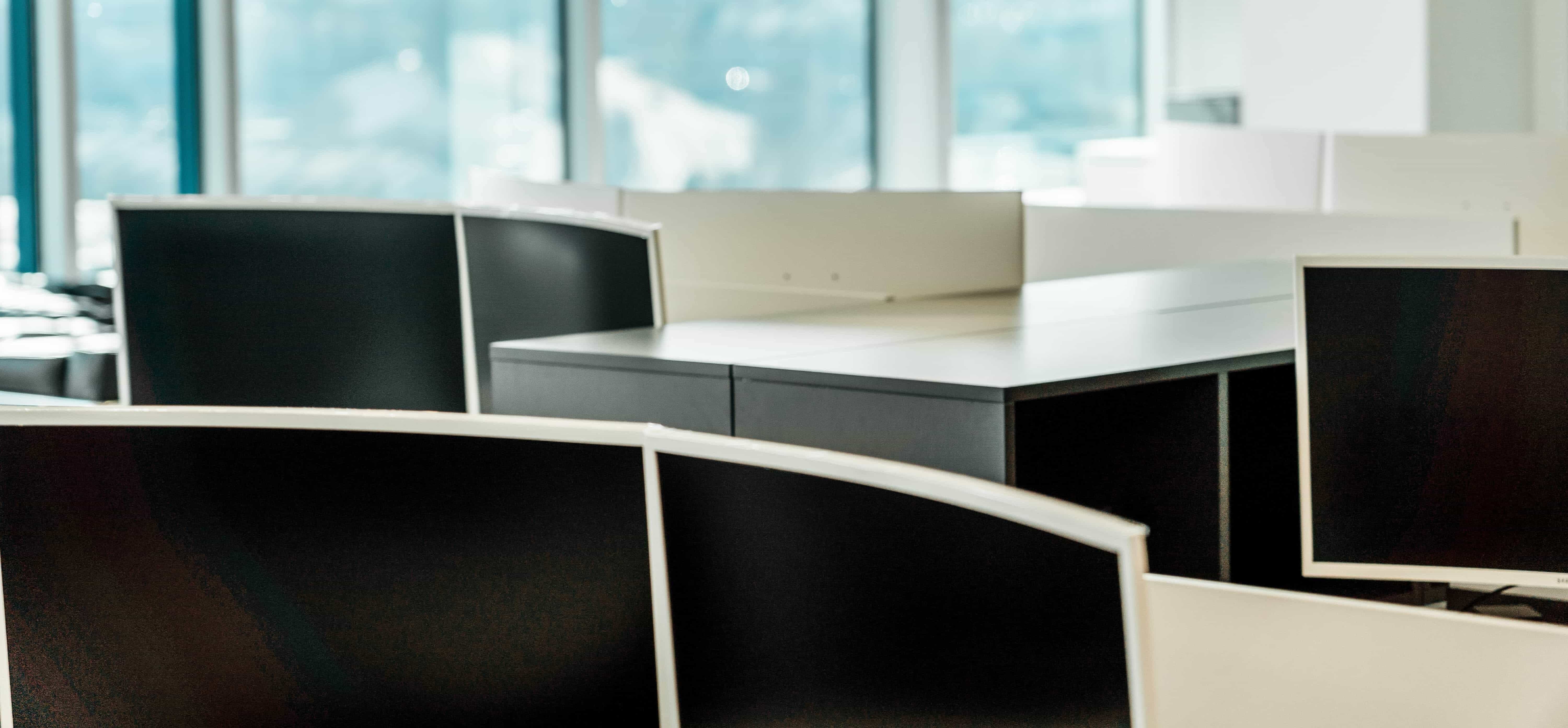 A photo of desks in the SLCG Economic Consulting Office.