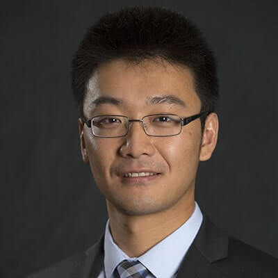 Headshot of Chuan Qin, Director of Research at SLCG Economic Consulting